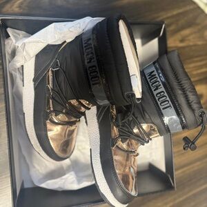 Moon Boot Shiny Black and Gold Snow Boots